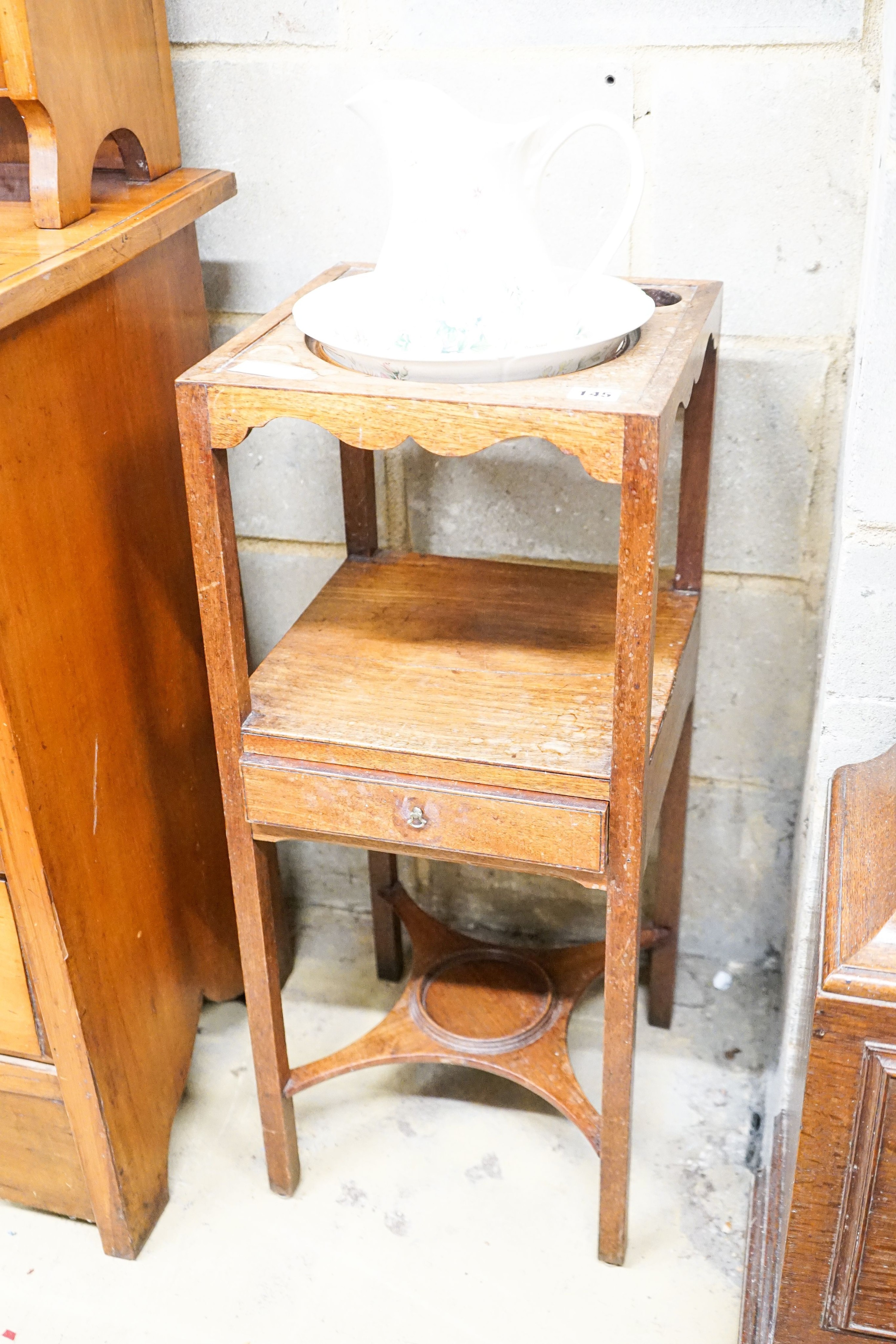 A George III mahogany wash stand with a later jug and basin, overall height 94cm